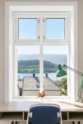 a window in a room with a desk and a chair at Large apartment with 5 bedrooms, 2 bathrooms and roof terrace in Ålesund