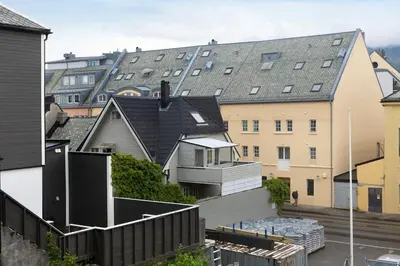 a group of buildings with roofs at City apartment with 4 bedrooms & private terrace in Ålesund