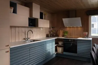 a kitchen with a sink and a stove at 4-Bedroom Ski-In Family Cabin at Geilolia hyttetun in Hol