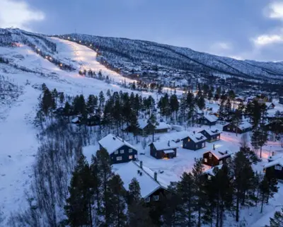 a small village in the snow with trees and buildings at 4-Bedroom Ski-In Family Cabin at Geilolia hyttetun in Hol