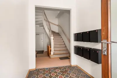 a hallway with a staircase in a house at BB Apartments I 300m to Bryggen & Train Station in Bergen