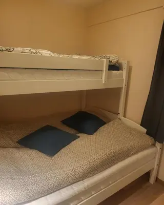 a bunk bed with two pillows on the bottom bunk at Synnseter, Synnfjellet, Fjellstuguvegen 38, 2880 Nord Torpa in Lii