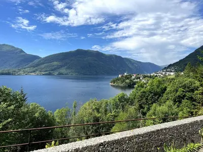 a view of a lake with mountains in the background at Fjord view apartment in Vaksdal