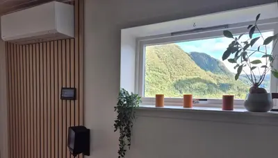a window in a room with a view of a mountain at Bluewater Cottage - Blåvannshytta in Bergen