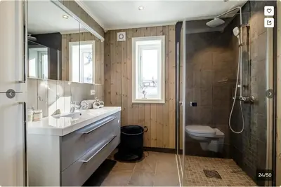 a bathroom with a sink and a shower and a toilet at Modern Mountain Escape in Beitostøl
