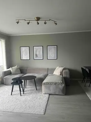 a living room with a couch and a table at Cozy apartment at Laksevåg! in Bergen