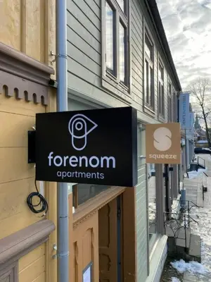 a sign on a building that reads forron departments at Central and Spacious Apartment for 6 in Trondheim