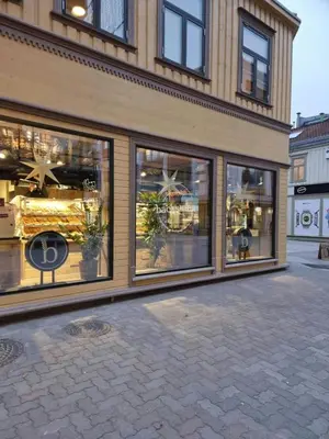 a store front with large windows on a street at Central and Spacious Apartment for 6 in Trondheim