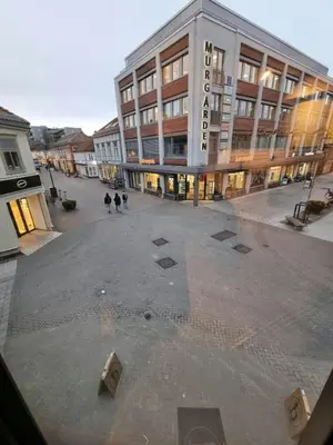 an empty street in front of a large building at Central Studio for 2 in Trondheim