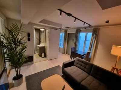 a living room with a couch and a table at Central Apartment for 4 in Trondheim