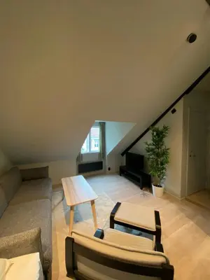 a living room with a couch and a table at Central Apartment for 5 in Trondheim