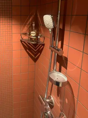 a bathroom with a shower with a shower head at Modern Cabin With Views Of Hallingskarvet in Torpo
