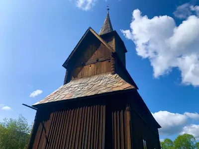 a wooden building with a steeple on top of it at Modern Cabin With Views Of Hallingskarvet in Torpo