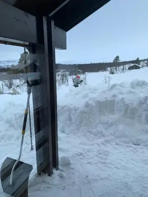 a view of a snow covered yard from a house at Modern Cabin With Views Of Hallingskarvet in Torpo