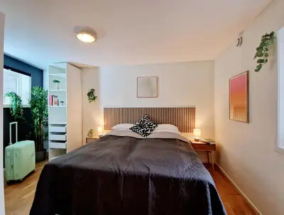 a bedroom with a large bed in a room at Prime location amazing king bed colorful oasis in Bergen