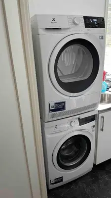 a washer and dryer sitting next to each other at Cozy house on Gryttingshaugen, near Vinstra in Sør-Fron