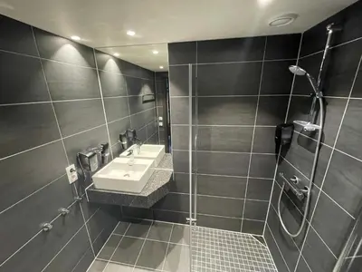 a bathroom with a sink and a shower at Gausta Sportell in Gaustablikk