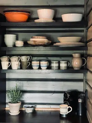 a shelf full of bowls and plates and cups at Spacious Family Cabin In Western Golsfjellet in Gol