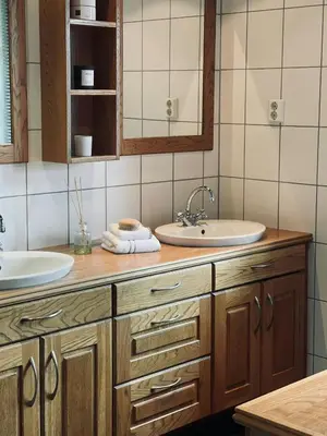 a bathroom with a sink and two mirrors at Spacious Family Cabin In Western Golsfjellet in Gol