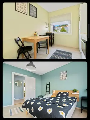 a bedroom and a living room with a bed and a table at Great Downtown Apartment in Lii