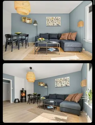 a living room with a blue couch and a table at Great Downtown Apartment in Lii