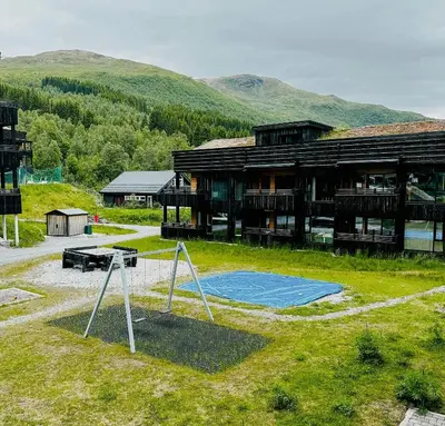 a building with a basketball hoop in front of it at Mountain Apartment With Views In Myrkdalen in Vossestrand
