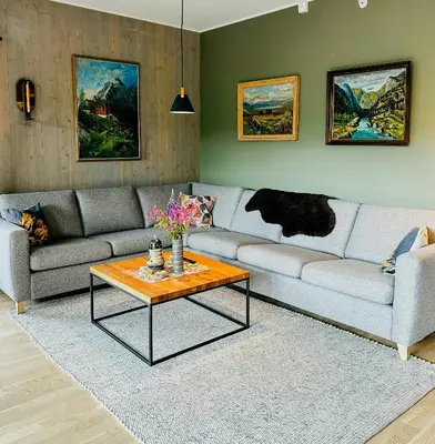a living room with a couch and a coffee table at Mountain Apartment With Views In Myrkdalen in Vossestrand