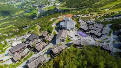 an aerial view of a village with houses at Spacious Family Apartment in Hemsedal, Ski In-Out, Sauna, 30m from Skarsnuten hotell in Hemsedal