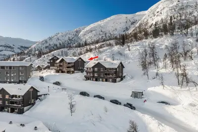 an aerial view of a resort in the snow at Spacious Family Apartment in Hemsedal, Ski In-Out, Sauna, 30m from Skarsnuten hotell in Hemsedal