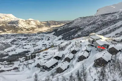 an aerial view of a ski resort in the snow at Spacious Family Apartment in Hemsedal, Ski In-Out, Sauna, 30m from Skarsnuten hotell in Hemsedal