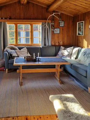 a living room with a couch and a coffee table at Traditional Family Cabin Near Rabalen in Bagn