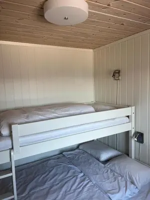 a bunk bed in a room with a ceiling at Mountain Sauna Lodge - Private Sunset Deck in Vossevangen