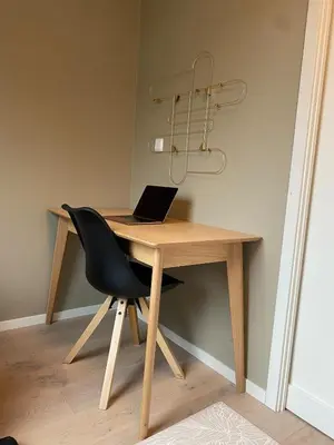 a wooden desk with a laptop on top of it at Familyhome for 8 people - 4 bedrooms - 10min from Bergen city center in Bergen