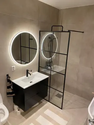 a bathroom with a sink and a mirror at Familyhome for 8 people - 4 bedrooms - 10min from Bergen city center in Bergen