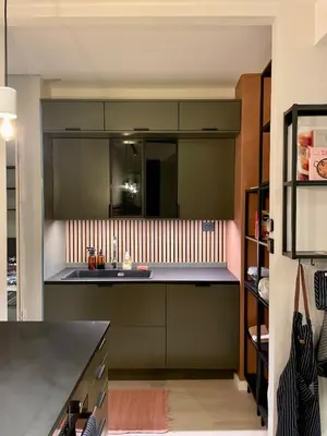 a kitchen with green cabinets and a sink at Private room with a view and garden - 12 min from the city center in Bergen