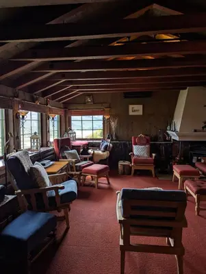 a living room with couches and chairs on a train at Bloksberg - cabin with amazing view and ski inn-out in Geilo