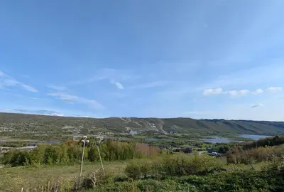 a view of a town and a river from a hill at Bloksberg - cabin with amazing view and ski inn-out in Geilo