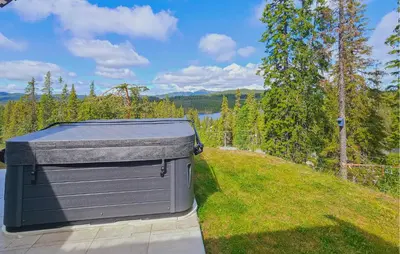 a large metal container sitting on top of a yard at Awesome Home In Vinje With Sauna in Trovatn
