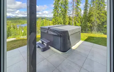 a television sitting on top of a patio at Awesome Home In Vinje With Sauna in Trovatn