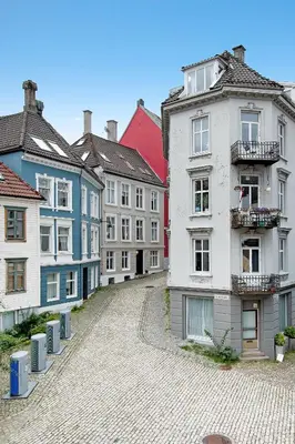 a group of buildings in a cobblestone street at Charming Apartment, Walk to Everything in Bergen in Lii