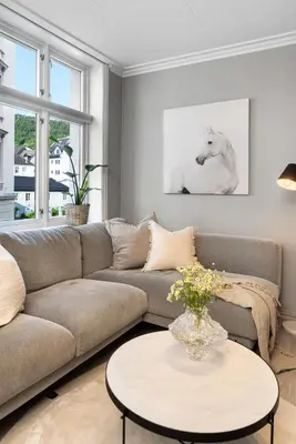 a living room with a couch and a table at Charming Apartment, Walk to Everything in Bergen in Lii