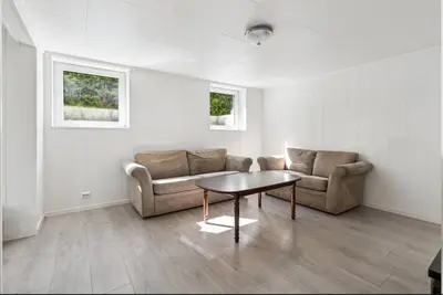 a living room with a couch and a table at Family & Friends Space in Råholt in Lii