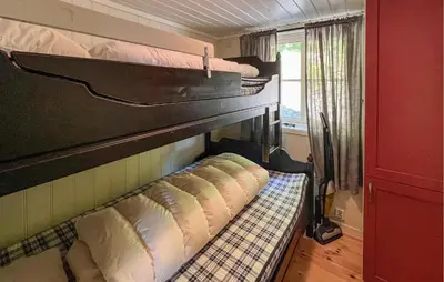 a group of bunk beds in a room at Gorgeous Home In Sjusjøen With Sauna in Sjusjøen