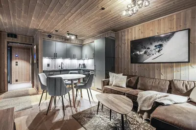 a living room with a couch and a table at Fritidsbolig i Hemsedal in Kyrkjebøen