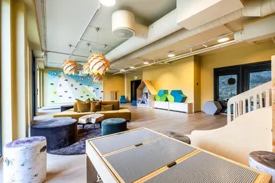 a living room with yellow walls and couches at Fritidsbolig i Hemsedal in Kyrkjebøen
