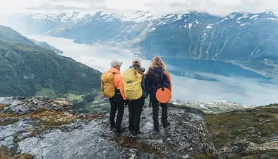 a group of people standing on top of a mountain at Hardanger Odda Apartments in Odda