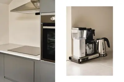 a kitchen with a coffee maker on a counter at Hardanger Odda Apartments in Odda