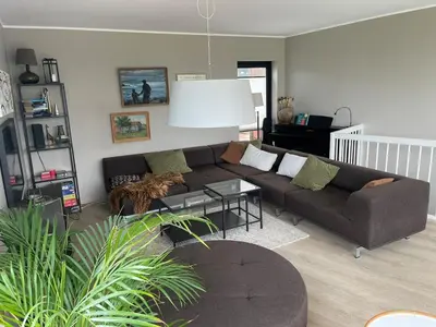 a living room with a couch and a table at Modern house - perfect for holidays in Bergen in Bergen