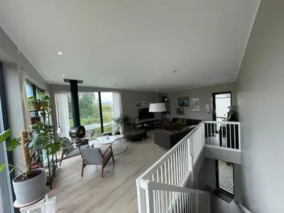 a large living room with a staircase and a living room at Modern house - perfect for holidays in Bergen in Bergen