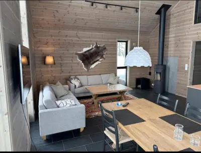a living room with a couch and a table at The Lookout at Beitostølen in Beitostøl